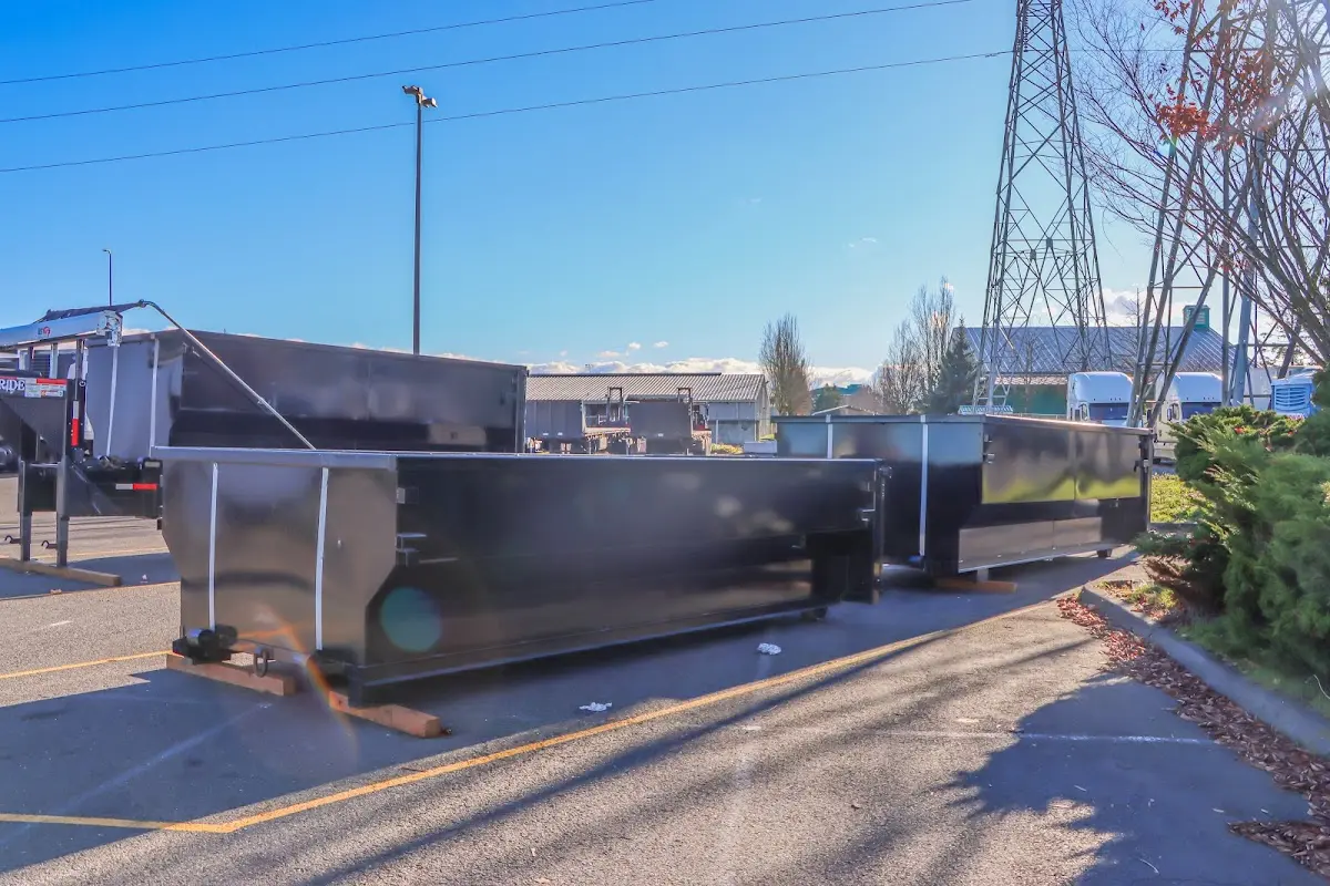 Roll-off dumpster ready for waste disposal at job site for Yard Waste Dumpster Rental in East Lyme